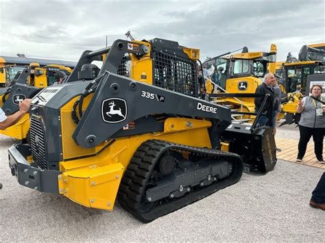 john deere mini ride on skid steer|john deere 335g price.